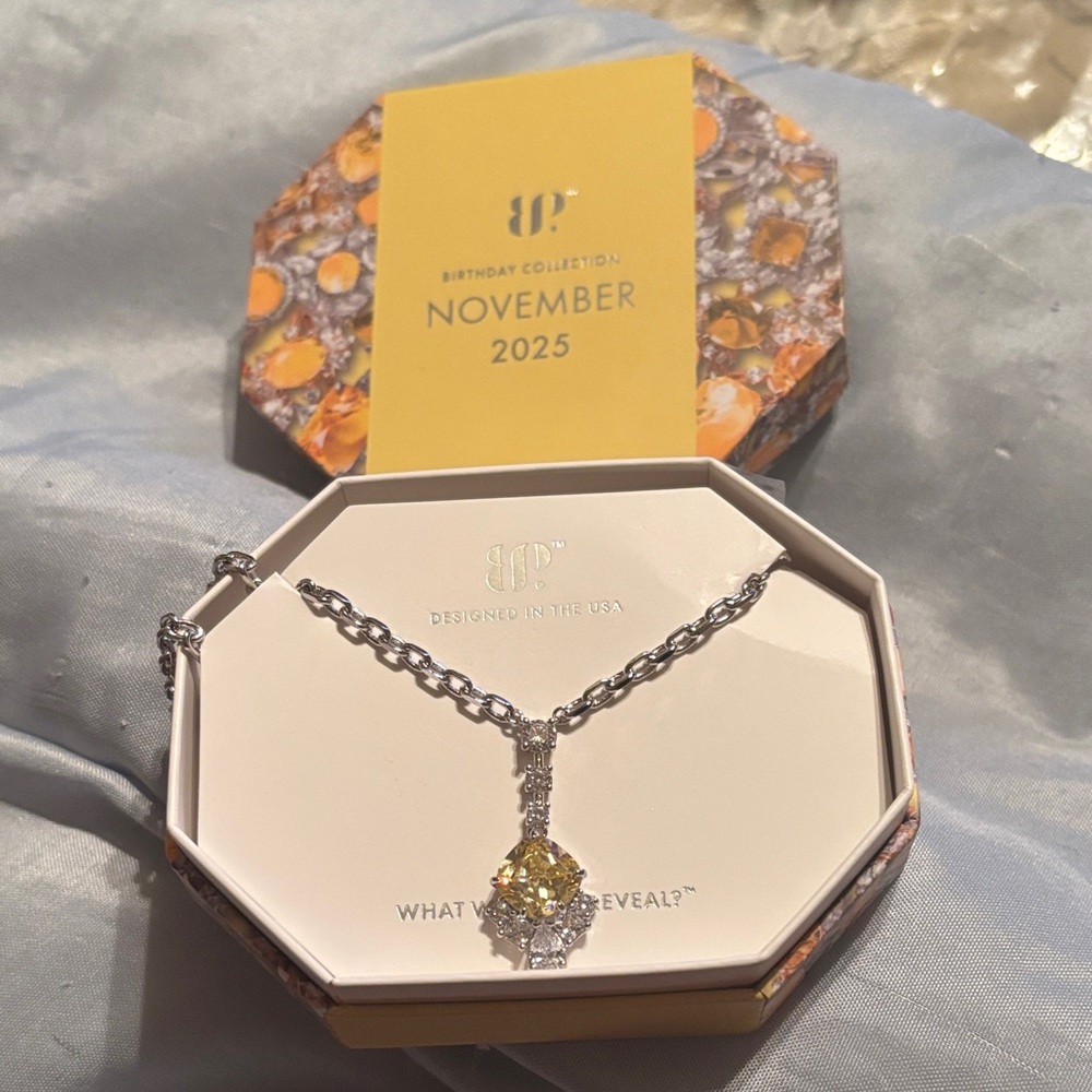 November 2025: In the Orbit of Grace. Citrine on rhodium.